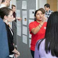  Swathi Chandrika ’21 explains her group’s project, building an experiment to predict the behavior of a mass on a spring when released at different positions and with different masses.